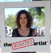 Crista Cloutier holding large polaroid frame