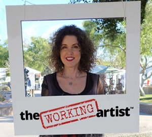 Crista Cloutier holding large polaroid frame