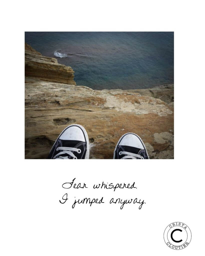 Tip of a Converse shoe can be seen on the cliff by the sea with texts saying "Fear whispered, I jumped anyway"