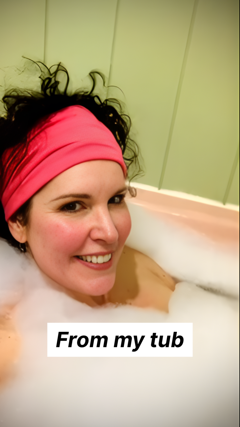 Crista in bathtub getting ready because in a few hours she will be hosting the Welcome Salon for the Working Artist Academy